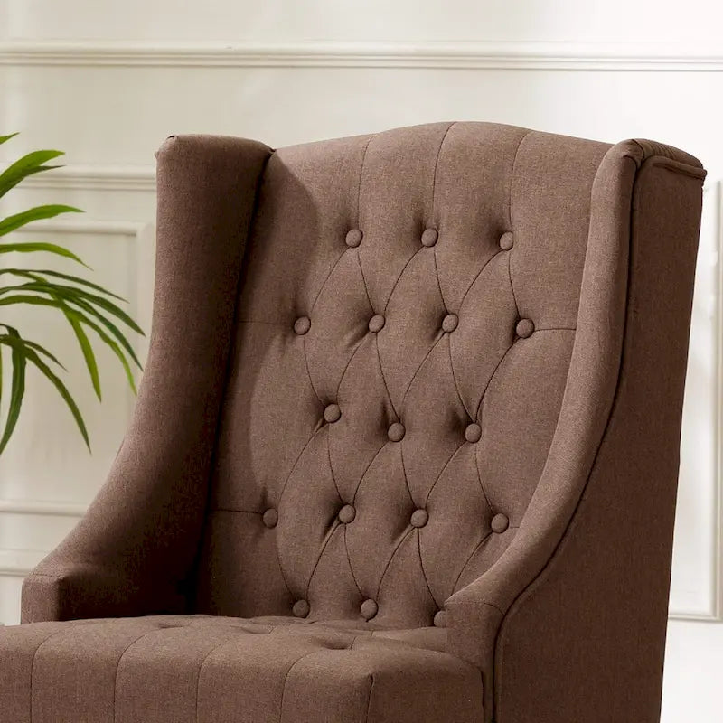 Poltrona Wingback con Schienale Trapuntato e Telaio in Legno Massello